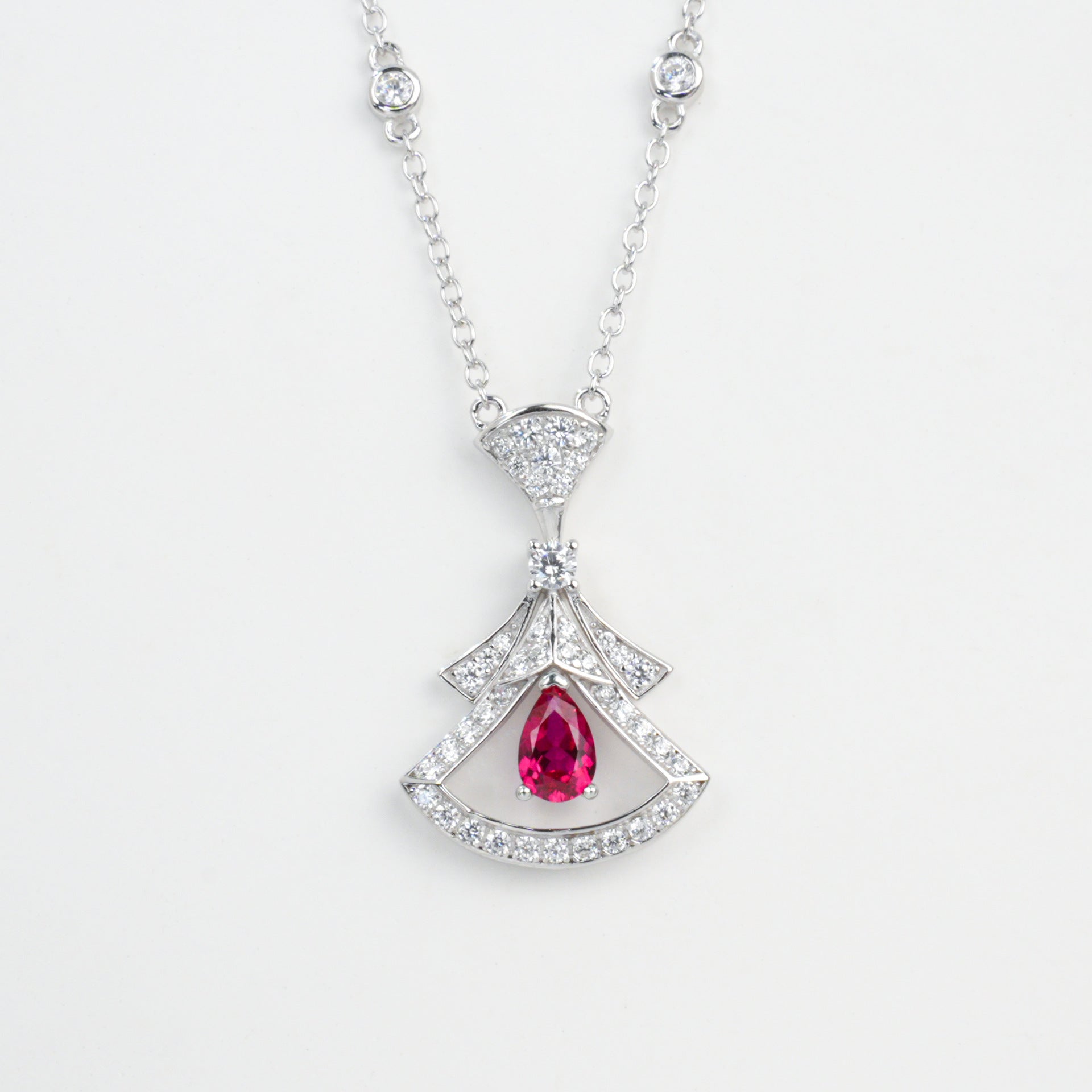 Origsoul sterling silver necklace with red gemstone pendant and clear sparkling accents