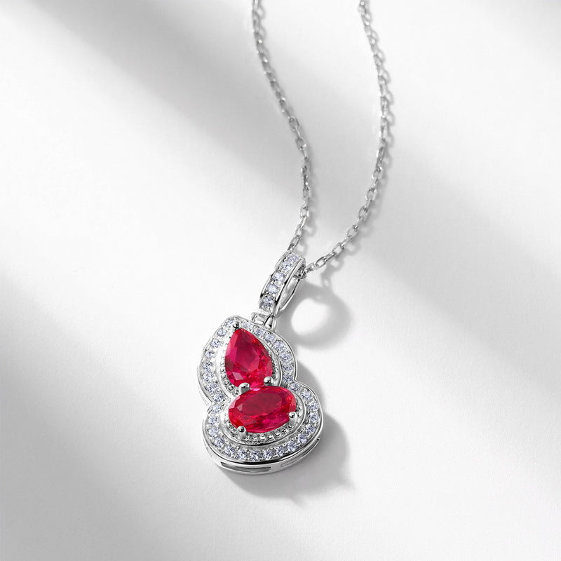 Origsoul sterling silver necklace with heart-shaped red gemstones and clear crystal accents