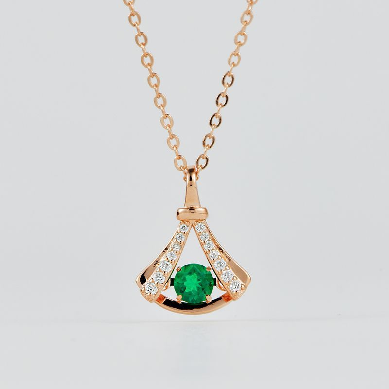 Origsoul sterling silver necklace with green gemstone pendant and small clear stones on gold chain