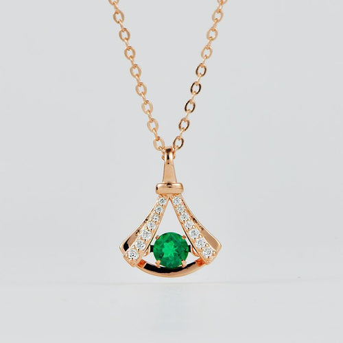 Origsoul sterling silver necklace with green gemstone pendant and small clear stones on gold chain