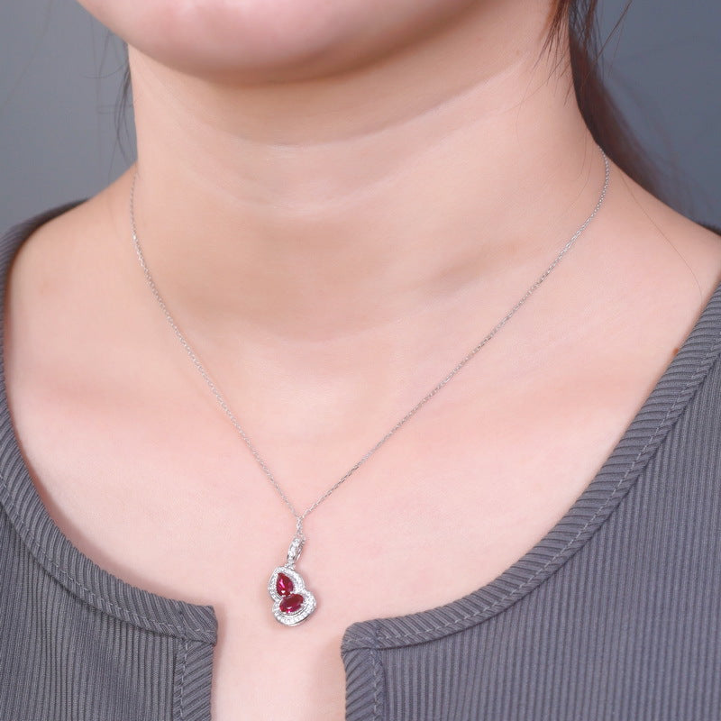 Origsoul sterling silver necklace with red gemstone heart pendant worn on neck