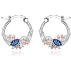 Origsoul sterling silver ocean turtle earrings with blue accents and leaf design