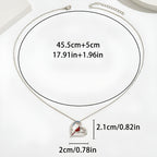 Origsoul sterling silver parrot necklace featuring a heart design with a red accent stone