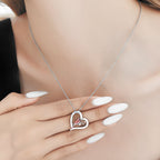 Origsoul sterling silver parrot necklace with heart pendant showcasing a delicate design