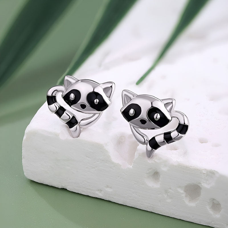 Cute sterling silver raccoon earrings featuring playful raccoon design with black accents