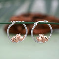 Sterling silver rhino earrings featuring cute rhino designs with rose gold accents