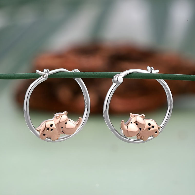 Sterling silver rhino earrings featuring cute rhino designs with rose gold accents