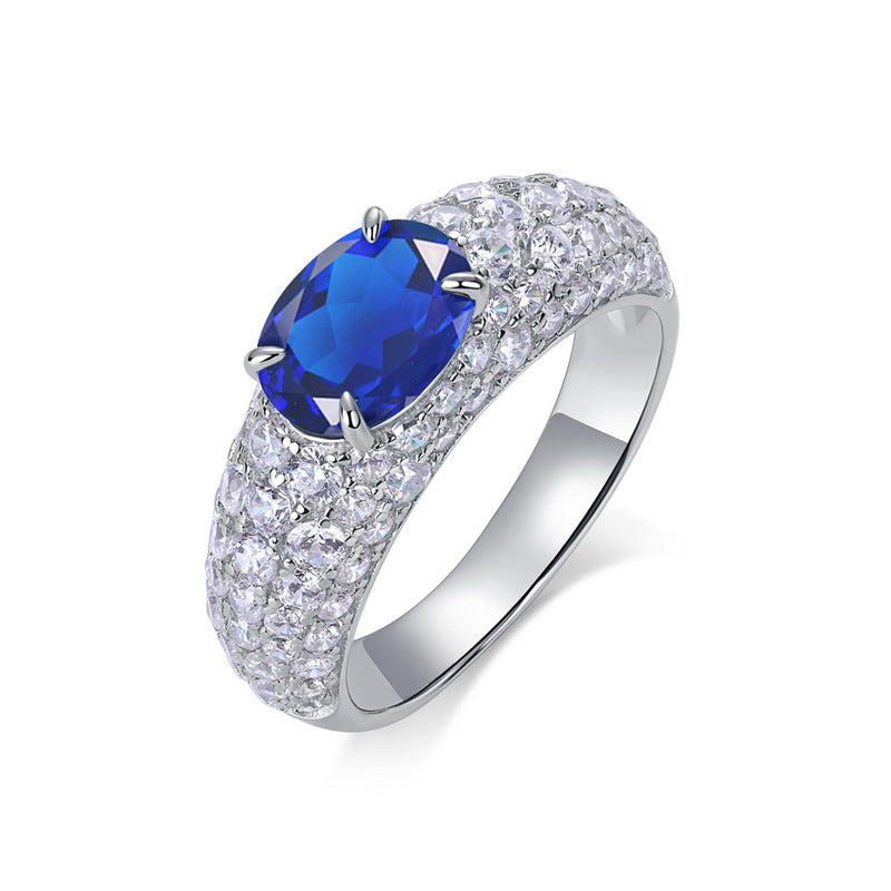 Origsoul sterling silver ring with large blue gemstone and pavé clear crystals band