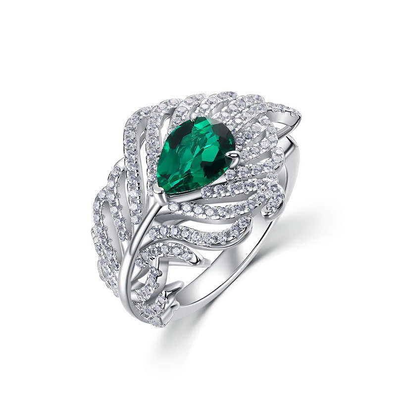 Origsoul sterling silver ring with green teardrop gemstone and intricate crystal accents