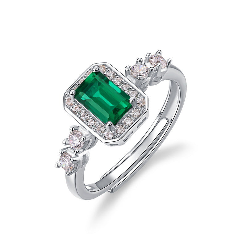 Origsoul sterling silver ring with emerald-cut green gemstone and small clear stones on band