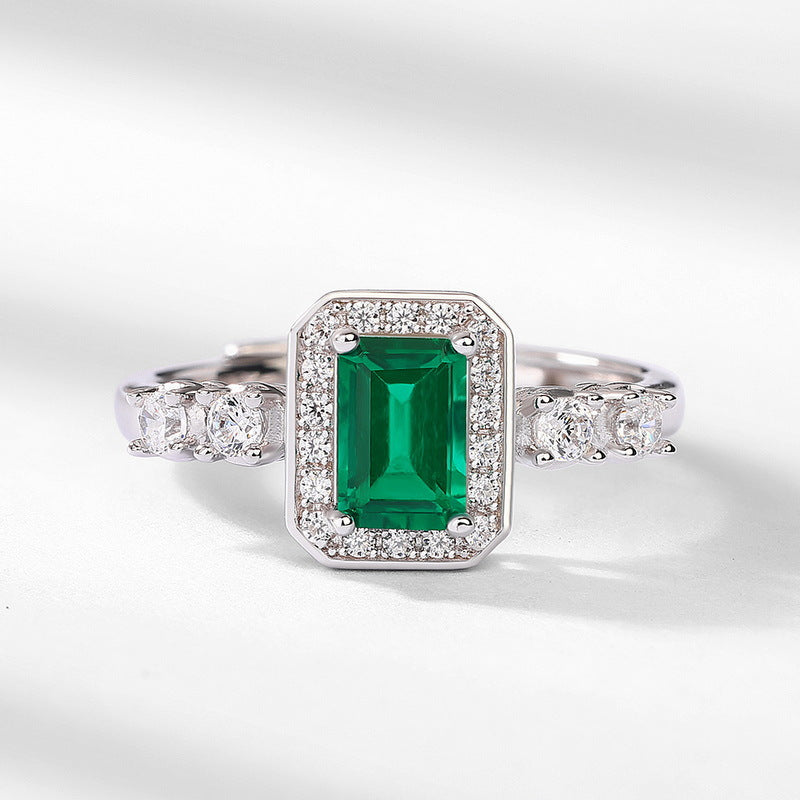 Origsoul sterling silver ring with emerald cut green gemstone and sparkling clear stones on band