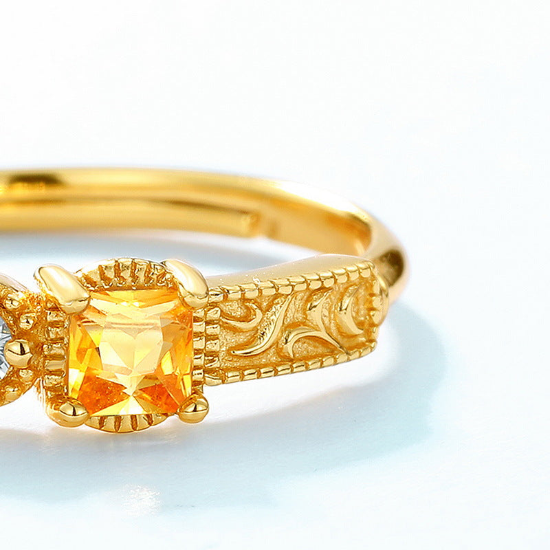 Origsoul sterling silver ring with intricate gold detailing and square yellow gemstone centerpiece