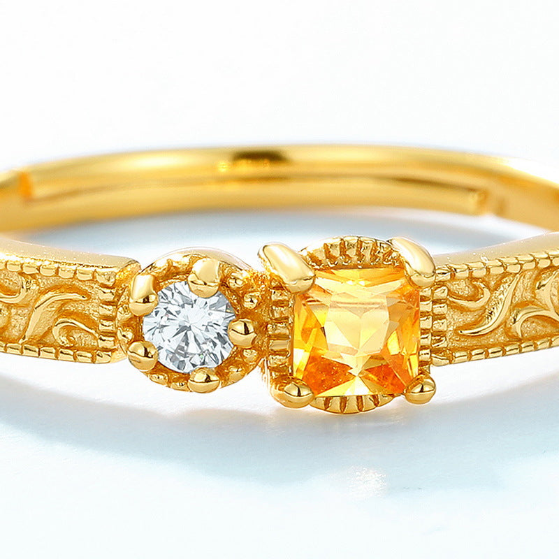 Origsoul gold ring with intricate designs featuring a small diamond and a square yellow gemstone sterling silver ring
