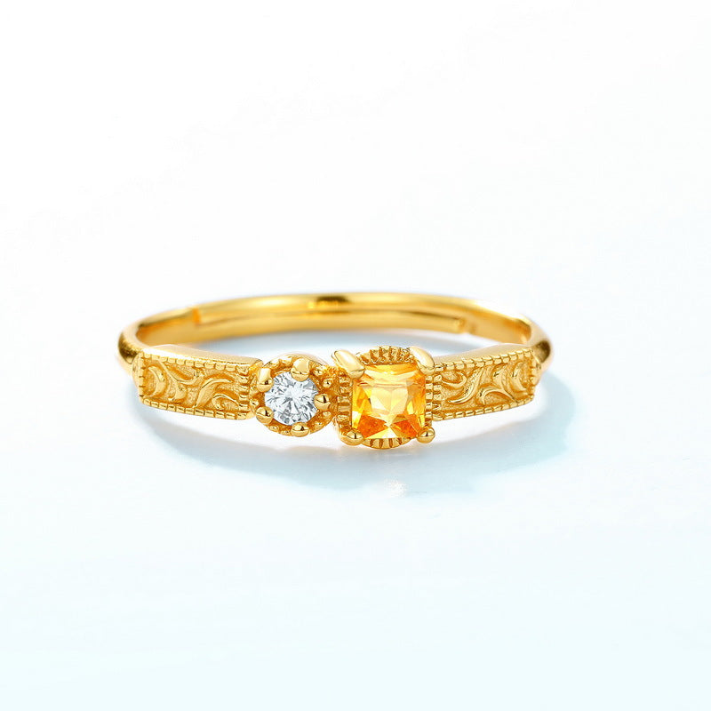 Origsoul gold ring with intricate design featuring a yellow and a white gemstone sterling silver ring