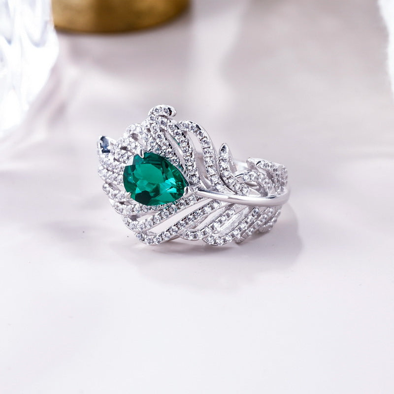Origsoul sterling silver ring with green gemstone and intricate feather design