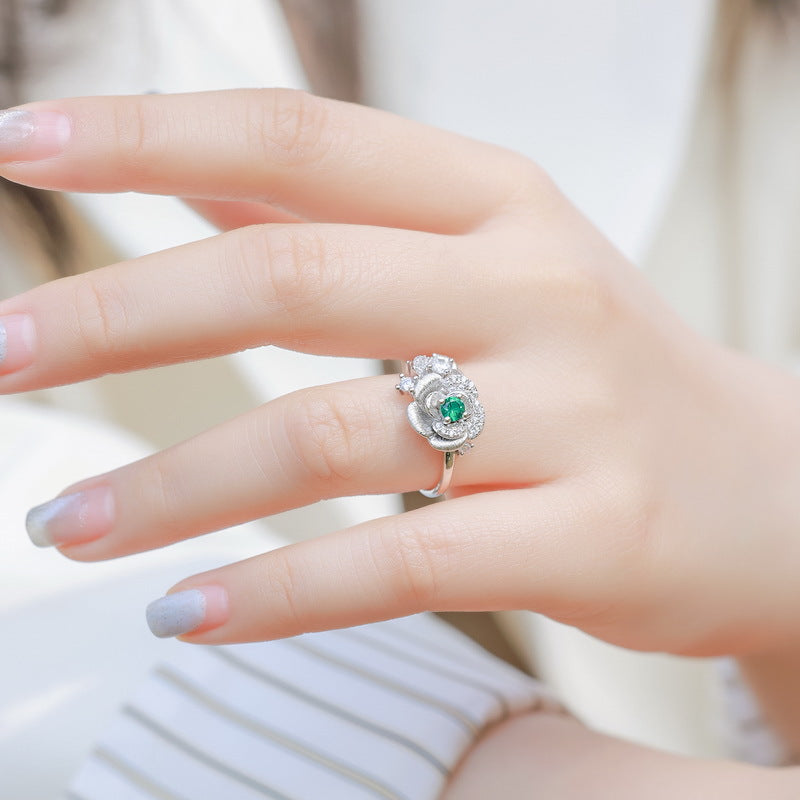 Origsoul sterling silver ring jewellery with green gemstone and intricate floral design on hand