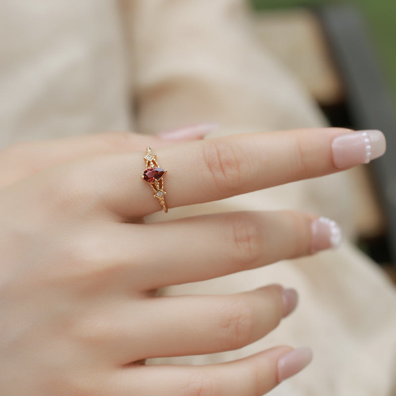 Origsoul sterling silver ring jewellery with red gemstone worn on hand with manicured nails