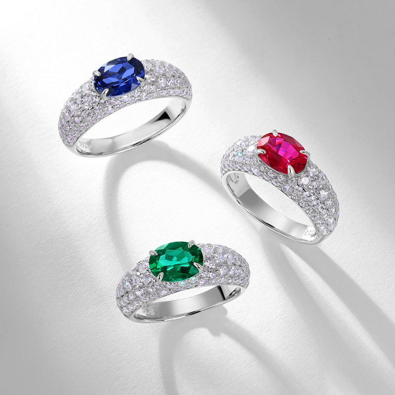 Origsoul sterling silver ring set with blue, red, and green oval gemstones and sparkling accents