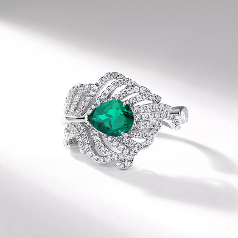 Origsoul sterling silver ring with pear-shaped green gemstone and intricate crystal detailing