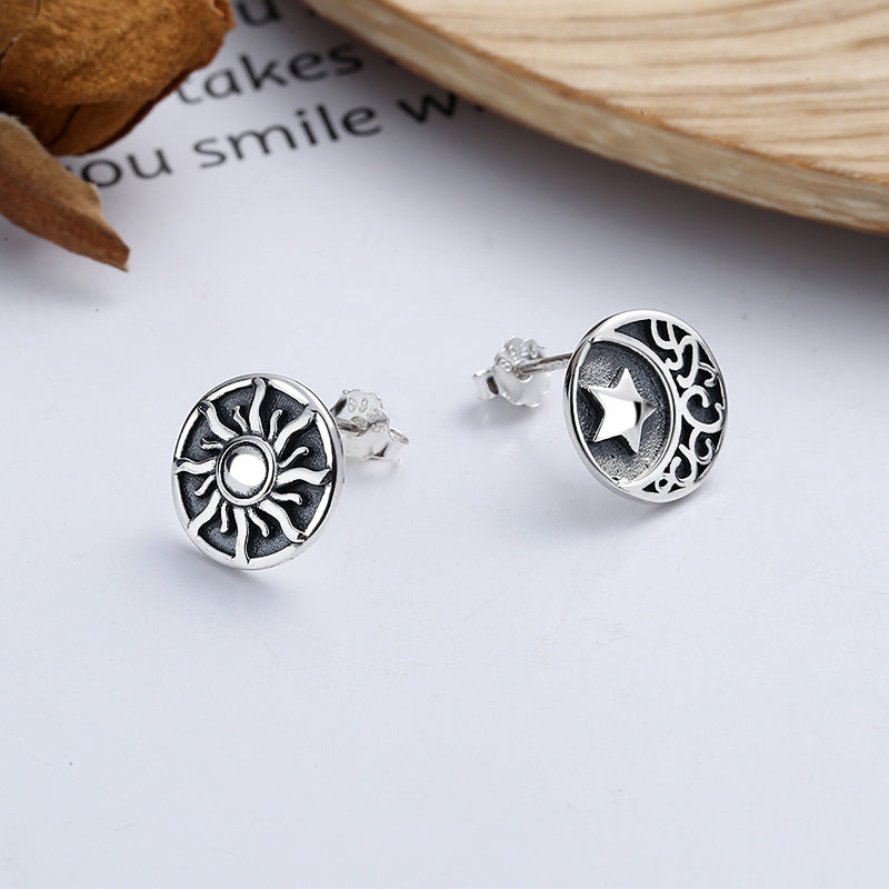 Origsoul cosmic sun and moon stud earrings in silver with detailed celestial designs