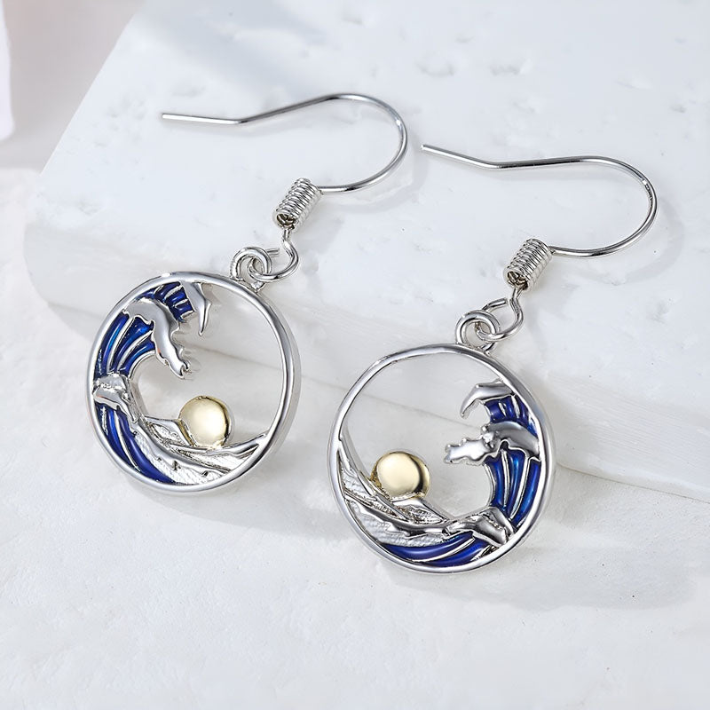 Origsoul sterling silver sunset wave earrings featuring a unique wave design and a gold accent
