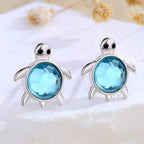 Origsoul sterling silver turtle earrings featuring blue gemstone accents for a playful look