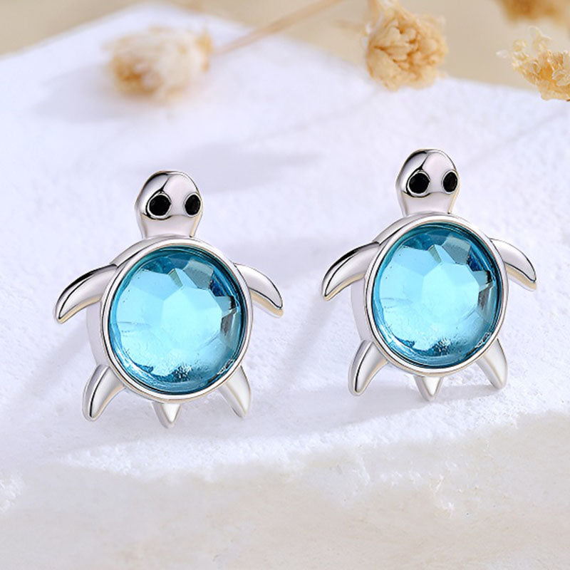 Origsoul sterling silver turtle earrings featuring blue gemstone accents for a playful look