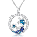 Origsoul sterling silver turtle necklace featuring blue turtles and wave design with sparkling accents