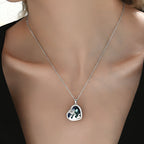 Origsoul sterling silver turtle necklace with a heart-shaped pendant featuring ocean waves
