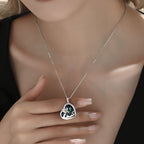 Sterling silver turtle necklace featuring a heart-shaped pendant with intricate design