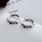 Origsoul cosmic jewelry twisted style earrings for women with silver hoops and black star accents