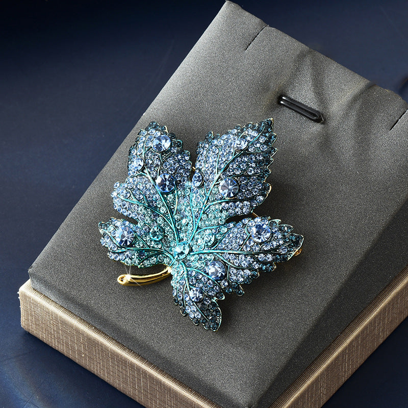 Origsoul brooch shaped as a sparkling toronto maple leaf decorated with blue rhinestones