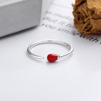 Origsoul unique minimalist silver ring with a small red accent bead on an open band