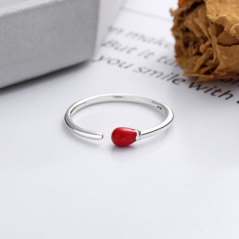 Origsoul unique minimalist silver ring with a small red accent bead on an open band