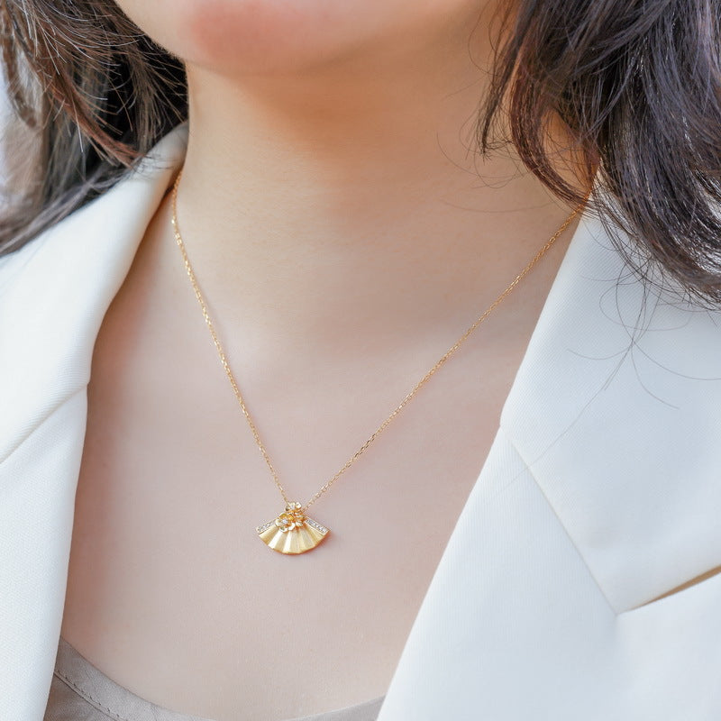 Origsoul gold van cleef and arpels vintage alhambra necklace worn with white blazer