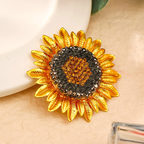 Origsoul Van Gogh sunflower brooch with gold petals and sparkling black and amber stones