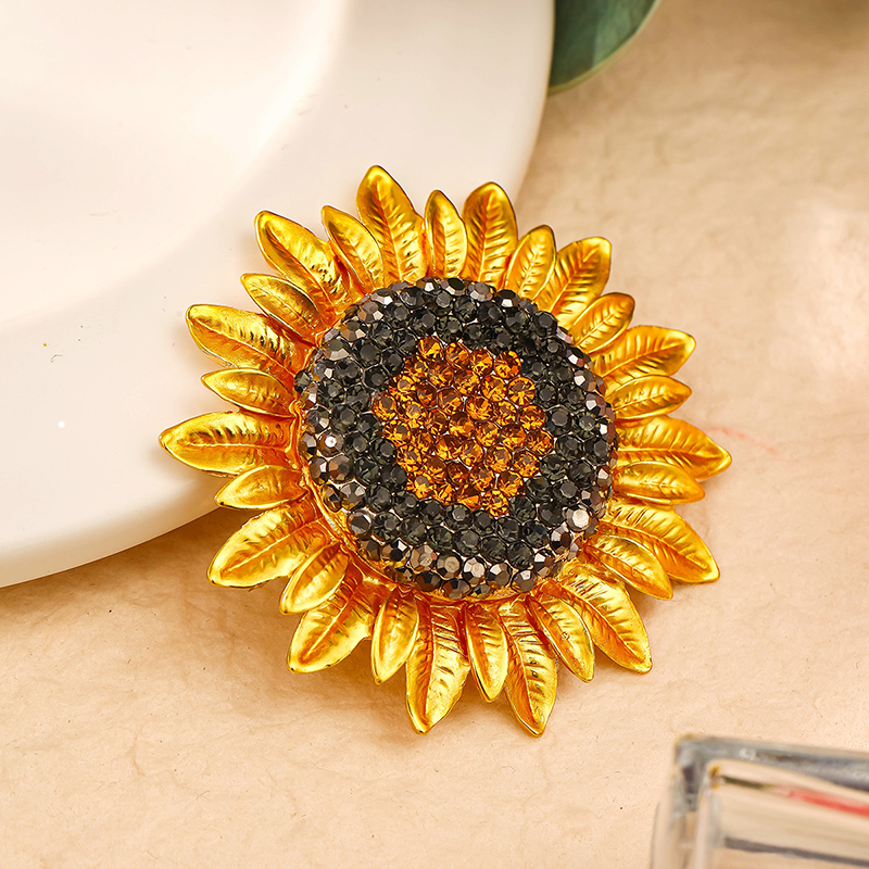 Origsoul Van Gogh sunflower brooch with gold petals and sparkling black and amber stones