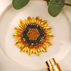 Origsoul Van Gogh sunflower brooch with gold petals and sparkling orange and black center