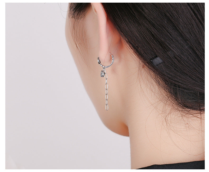 Origsoul silver cute rabbit charm earrings with chain detail worn on ear