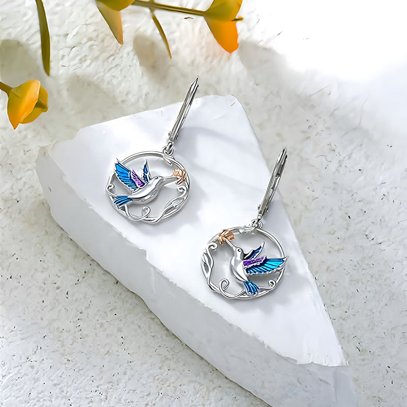 Origsoul handcrafted bird drop earrings with blue and purple enamel on silver circular design