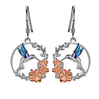 Origsoul handcrafted bird drop earrings featuring silver hoops with colorful hummingbirds and orange flowers
