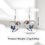 Origsoul hummingbird heart earrings with blue and red accents, silver tone and delicate design