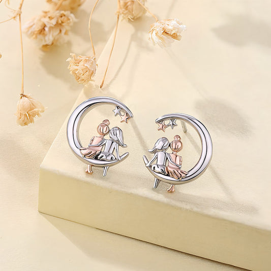 Origsoul moon and star fashion earrings featuring two girls sitting on crescent moons with stars