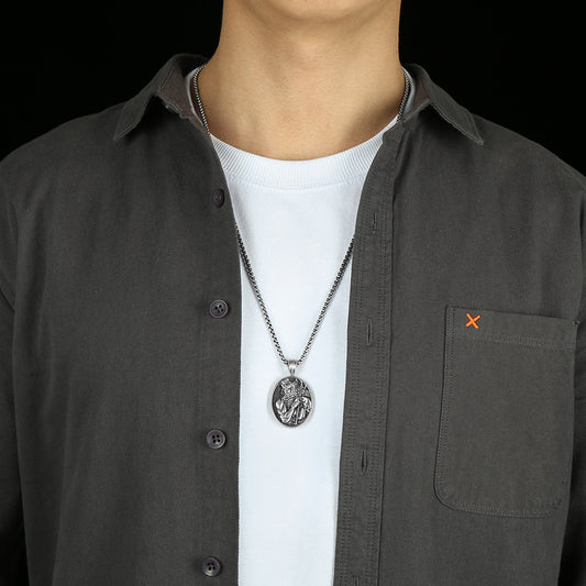 Mythology inspired necklace from Origsoul Tranquil Spirit Collection worn with black shirt and white t-shirt