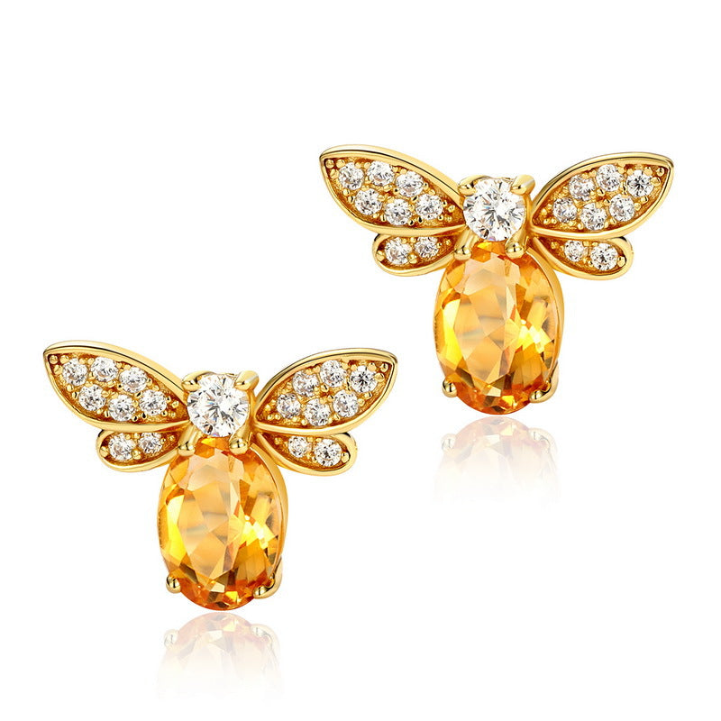 Origsoul gold butterfly earrings with crystal accents paired with silver necklace sterling