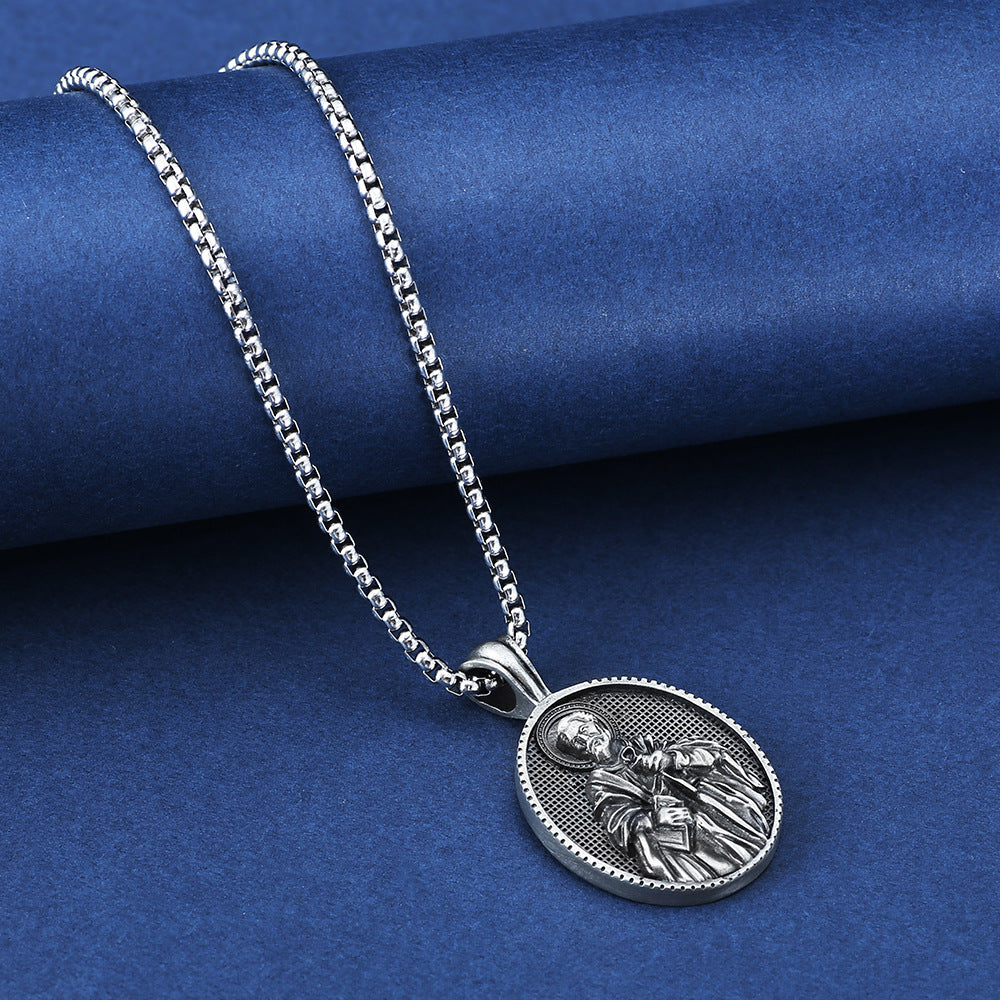 Silver saint medallion necklace from Origsoul Tranquil Spirit Collection with detailed saint pendant and chain