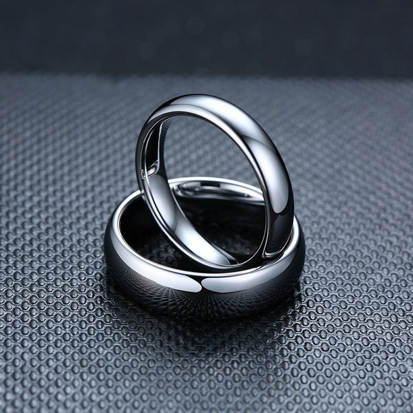 Origsoul smooth matching rings for couples with a polished silver finish on textured background