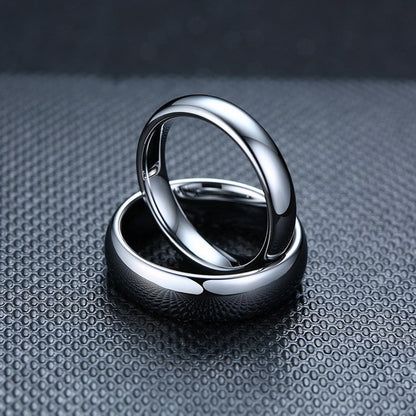 Origsoul smooth matching rings for couples with a polished silver finish on textured background