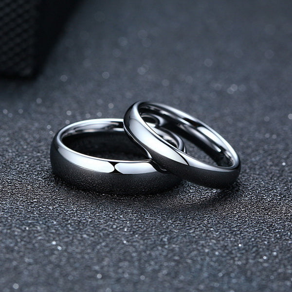 Origsoul smooth matching rings for couples in polished silver on textured black surface