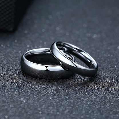 Origsoul smooth matching rings for couples in polished silver on textured black surface
